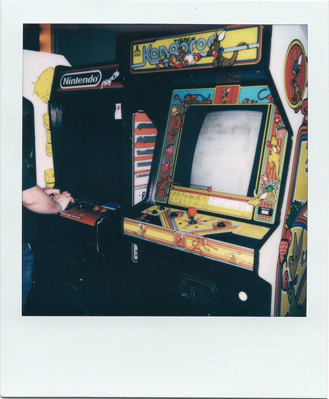 A Kangaroo arcade cabinet sits next to a Nintendo Play Choice 10 at the 2023 Texas Pinball Festival.<br> Polaroid One, 600 Film