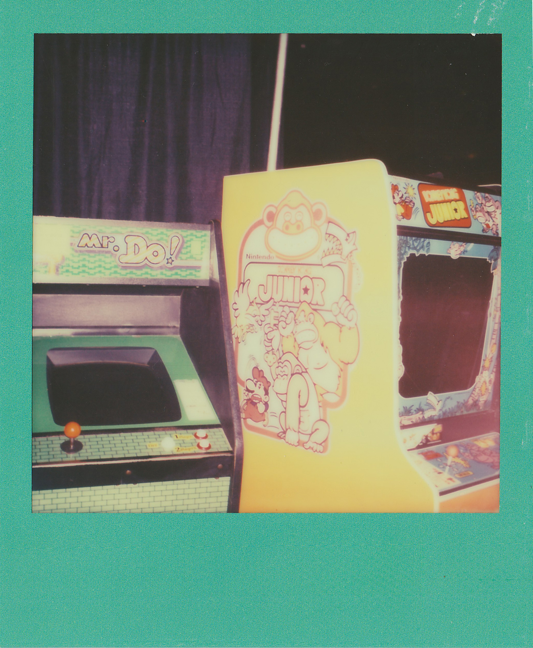 A Mr. Do! and Donkey Kong Junior cabinets at the Texas Pinball Festival 2014.<br>Polaroid SX-70, Impossible Project film.